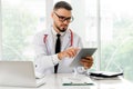 Doctor working on tablet computer in the hospital. Royalty Free Stock Photo