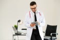 Doctor working on tablet computer in the hospital. Royalty Free Stock Photo