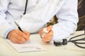 Doctor writing a perscription Royalty Free Stock Photo
