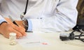 Doctor writing a perscription Royalty Free Stock Photo