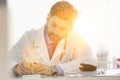 Doctor writing prescription at desk in hospital Royalty Free Stock Photo