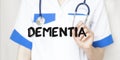 Doctor writing text DEMENTIA with marker, medical concept