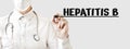 Doctor writing word HEPATITIS B with marker, Medical concept Royalty Free Stock Photo