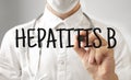 Doctor writing word HEPATITS B with marker, Medical concept Royalty Free Stock Photo