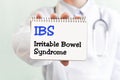 Doctor writing word IBS Irritable Bowel Syndrome with marker, Medical concept Royalty Free Stock Photo