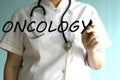 Doctor writing word oncology with marker. Medical concept