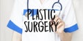 Doctor writing word Plastic Surgery with marker, Medical concept Royalty Free Stock Photo