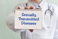 Doctor writing word Sexually Transmitted Diseases with marker, Medical concept