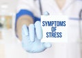 Doctor writing word symptoms of stress with marker, Medical concept Royalty Free Stock Photo