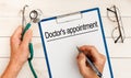 The doctor wrote - Doctor`s appointment, stethoscope, glasses, pen