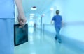 Doctor with x-ray picture in hospital corridor Royalty Free Stock Photo