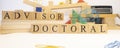 Doctoral advisor was created from wooden cubes. Education and career concept. Royalty Free Stock Photo