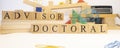 Doctoral advisor was created from wooden cubes. Education and career concept Royalty Free Stock Photo