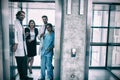 Doctors and businesswoman standing in elevator Royalty Free Stock Photo