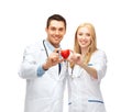 Doctors cardiologists with heart Royalty Free Stock Photo