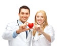 Doctors cardiologists with heart Royalty Free Stock Photo