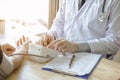 Doctors check blood pressure measurements, the patient on the table