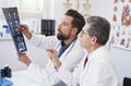 Two doctors consult the X-ray Image Royalty Free Stock Photo
