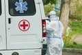 Doctors evacuate the patient with coronavirus, special protective suits