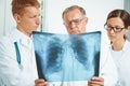 Doctors examine x-ray image in clinic