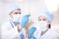 Doctors examining a blood sample in a laboratory