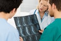 Doctors Examining X-ray Report Royalty Free Stock Photo