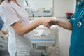 Doctors greeting each other with handshake in hospital