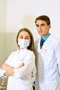 Doctors group. Portrait of surgeon and nurse standing with arms Royalty Free Stock Photo