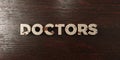 Doctors - grungy wooden headline on Maple - 3D rendered royalty free stock image