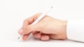 Doctors hand writing using a white pen, closeup, gesture isolated on white. Medical personnel, doctor holding a pen writing