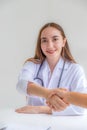 Doctors handshake after advice report health examination results and recommend medication to patients, occupational consultation