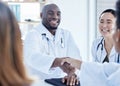 Doctors, handshake and healthcare meeting in agreement, teamwork welcome and collaboration. Happy medical employee Royalty Free Stock Photo