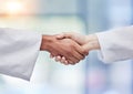 Doctors, handshake and healthcare partnership in agreement, teamwork deal or collaboration. Medical professionals Royalty Free Stock Photo