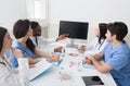 Doctors having lecture and taking notes in meeting room Royalty Free Stock Photo