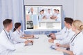 Doctors having video conference meeting in hospital Royalty Free Stock Photo