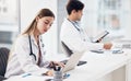 Doctors, healthcare and coworkers working at desk for planning, research and medical schedule at workspace in hospital Royalty Free Stock Photo