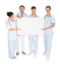 Doctors holding placard Royalty Free Stock Photo