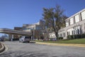 Doctors Hospital entrance with people cars and Heros sign side view