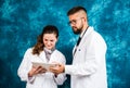Doctors looking at electronic tablet device Royalty Free Stock Photo