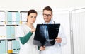 Doctors looking at x-ray in medical office Royalty Free Stock Photo