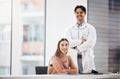 Doctors, man and woman with arms crossed in portrait, smile and hospital office with leadership for medical job. Clinic Royalty Free Stock Photo