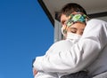 Doctors in masks hugging each other Royalty Free Stock Photo