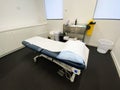 Doctors medical surgery with an examination bed and a trolley Royalty Free Stock Photo