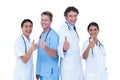 Doctors and nurse gesturing thumbs up Royalty Free Stock Photo
