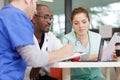 Doctors and nurse having informal meeting in hospital canteen