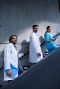 Doctors and nurse standing on staircase Royalty Free Stock Photo