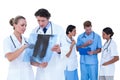 Doctors and nurses discussing over x-ray Royalty Free Stock Photo