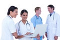 Doctors and nurses discussing and using laptop Royalty Free Stock Photo