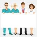 Doctors and nurses holding a blank billboard Royalty Free Stock Photo