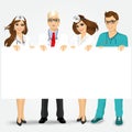 Doctors and nurses holding a blank billboard Royalty Free Stock Photo